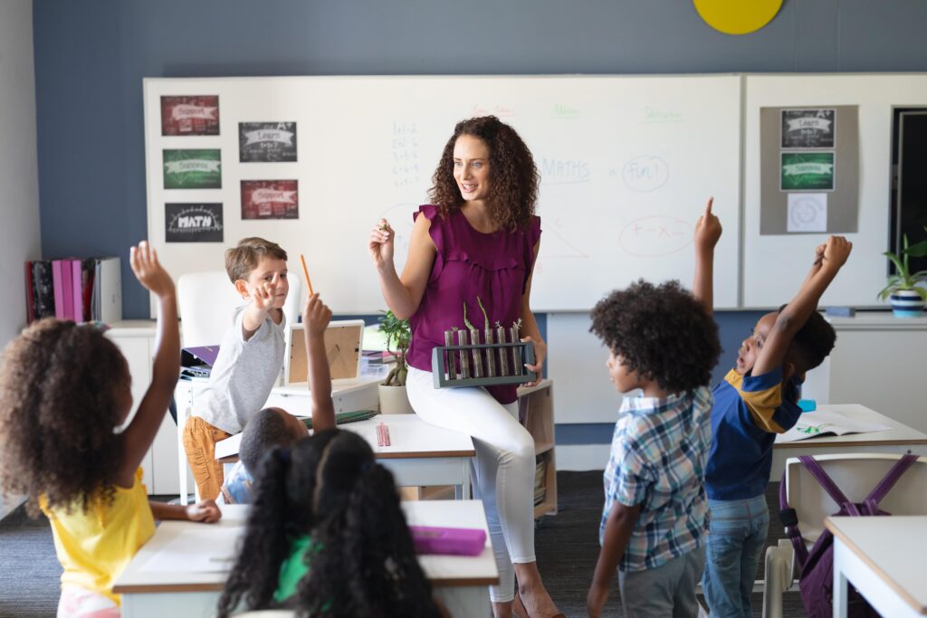 Elementary Classroom Teacher Helping Students
