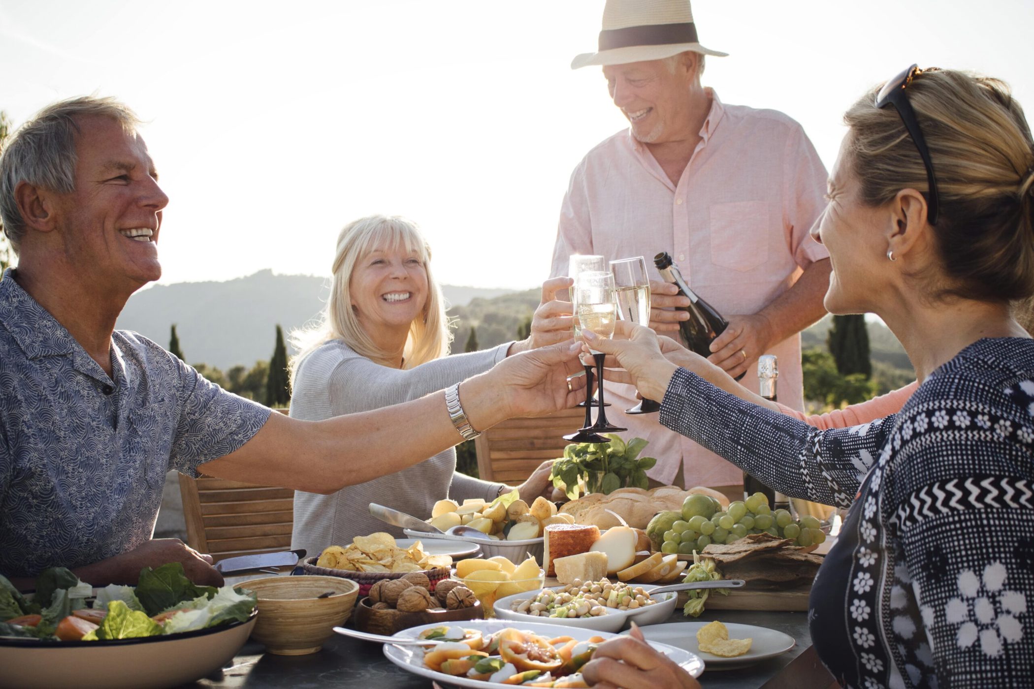 N Pic Active Adult Friends Outdoors Dining Toasting
