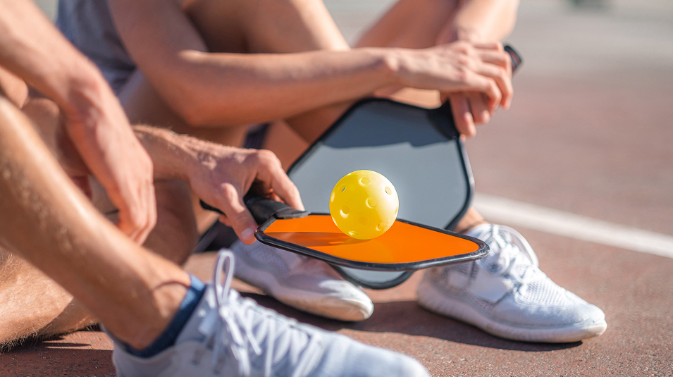 N Pic Sports Pickleball Couple Sitting (Pickleball Court in Villages of Greenhill)