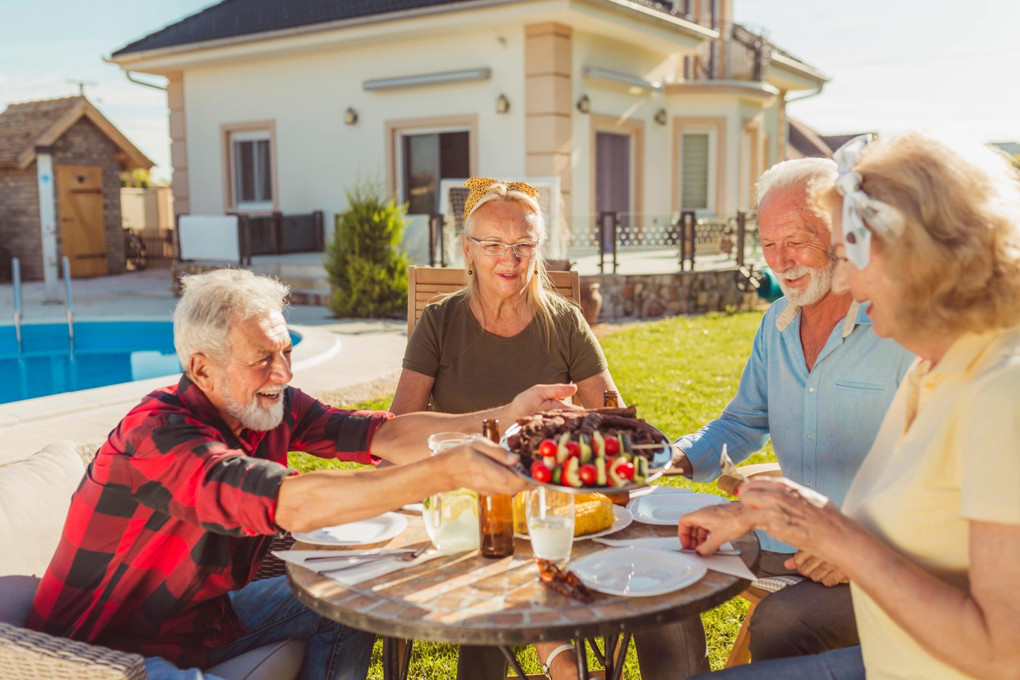 N Pic Active Adult Couples Backyard Gathering Patio Table Serving Food