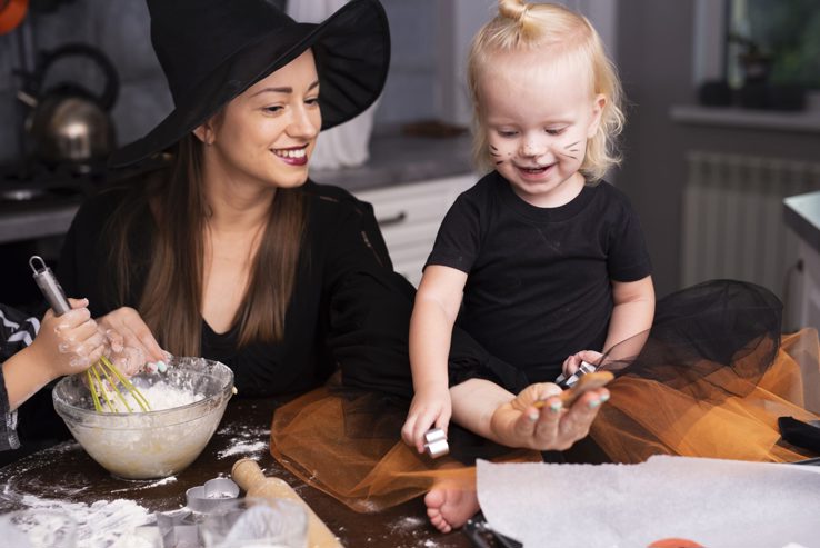 Mother Daughter Baking Cookies Halloween Witches Hat min scaled